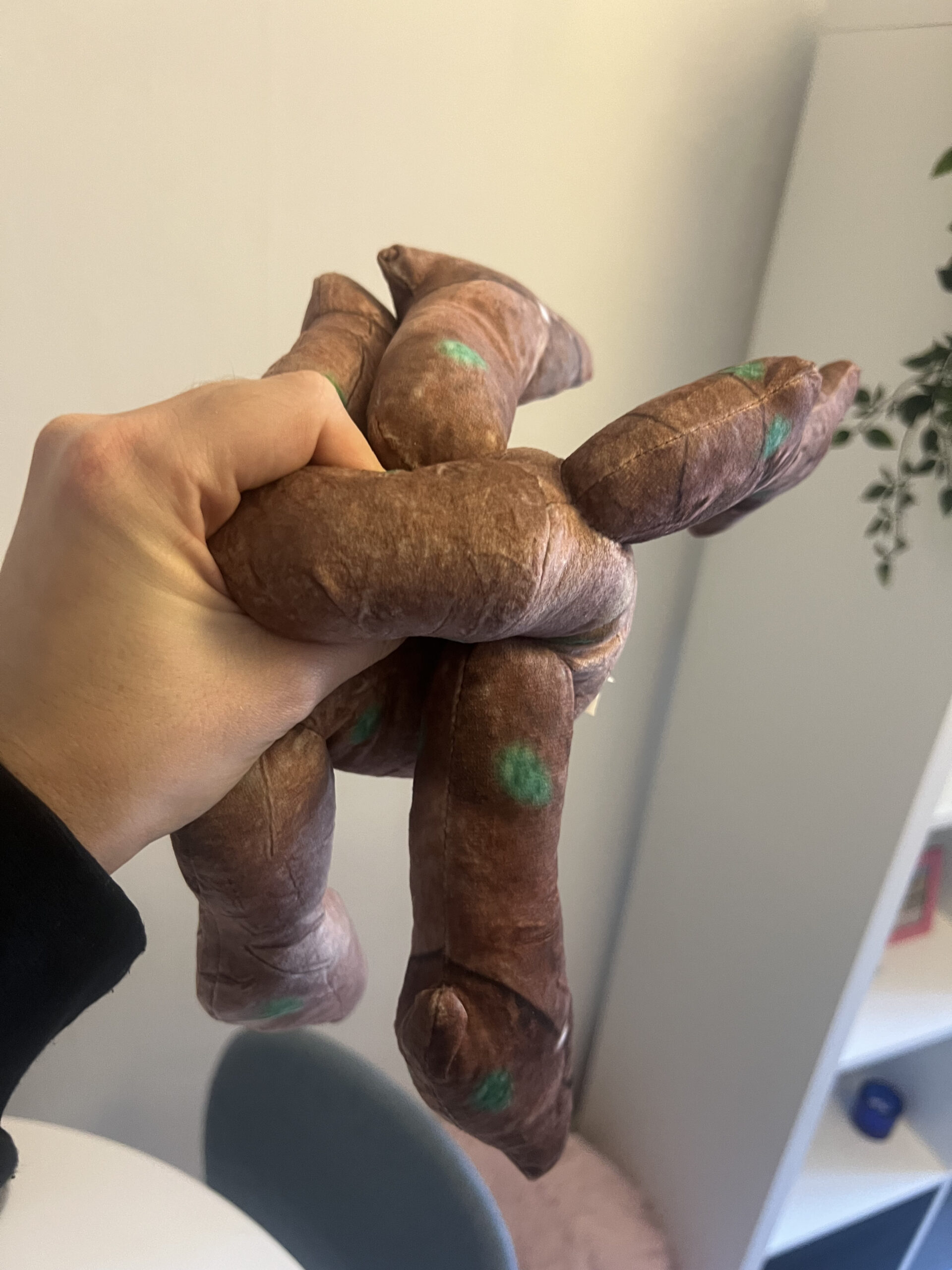 Project Hail Mary Rocky plush being squeezed to show softness and shape recovery