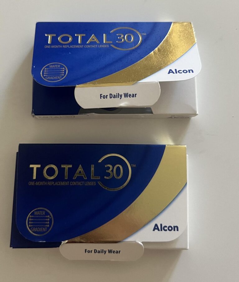 Two Alcon TOTAL30 monthly contact lens boxes in blue and gold, neatly framed from the front