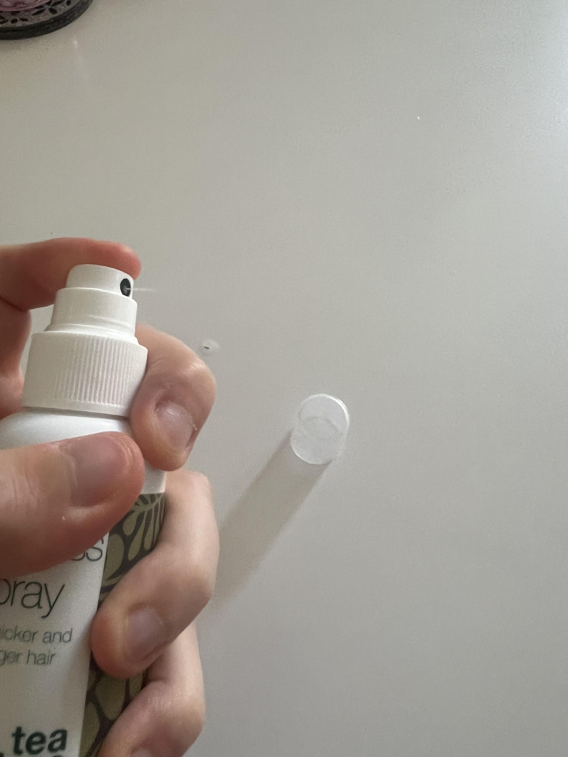 My actual Australian Bodycare Hair Loss Spray pump applicator with the clear protective cap removed