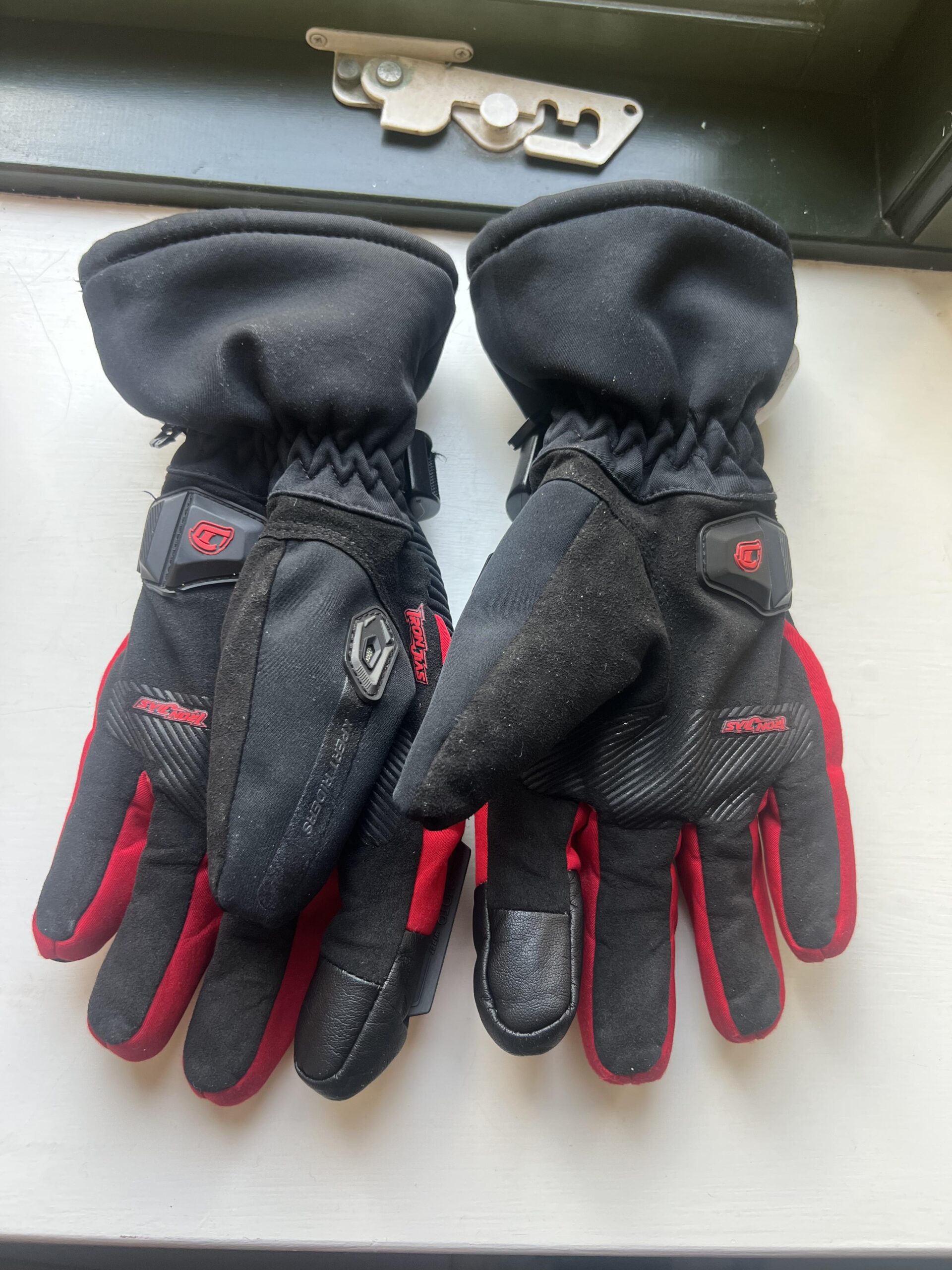 Palm side of IRON JIA'S winter motorcycle gloves showing grip surface after heavy use