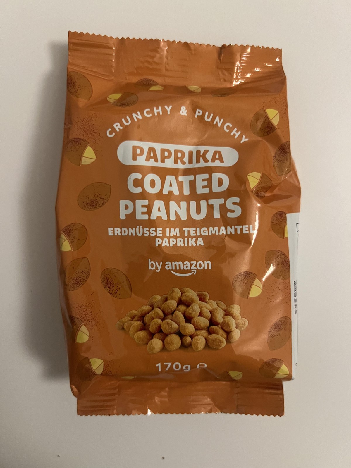 Original upright photograph of by Amazon Paprika Coated Peanuts 170 g orange packet front