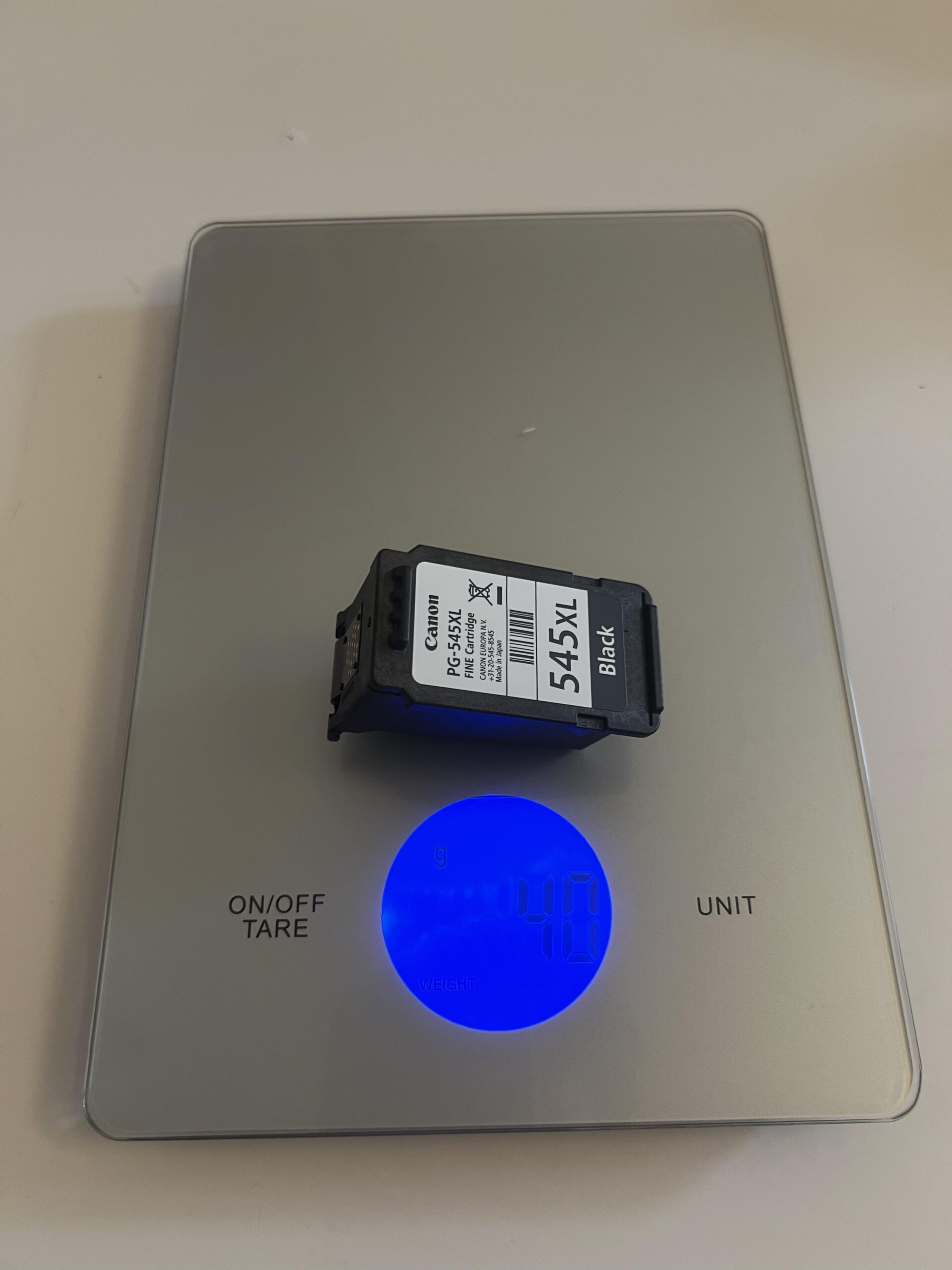 Canon PG-545XL Black cartridge on a household digital scale