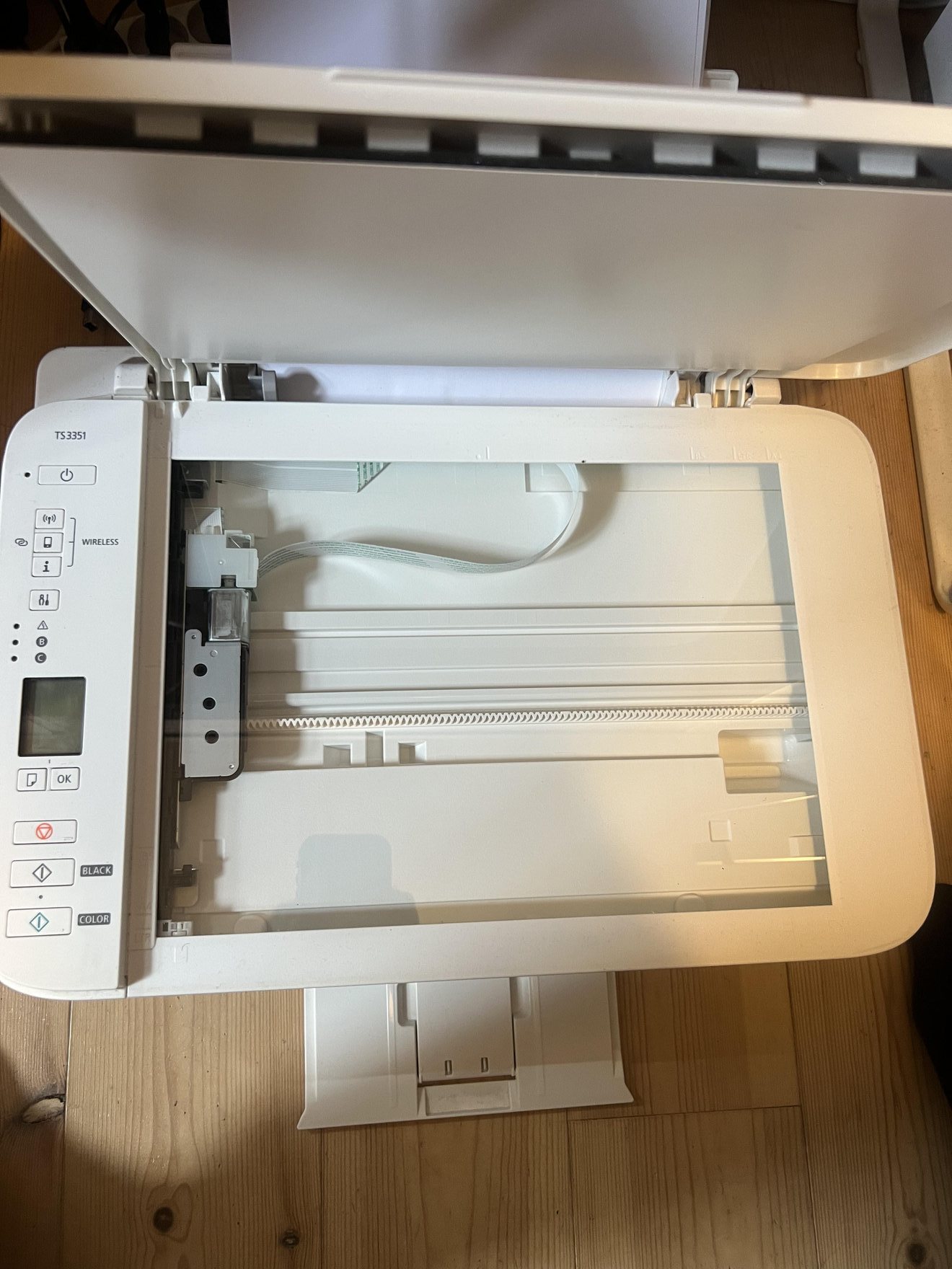 My Canon PIXMA TS3351 scanner lid open exposing the flatbed glass surface
