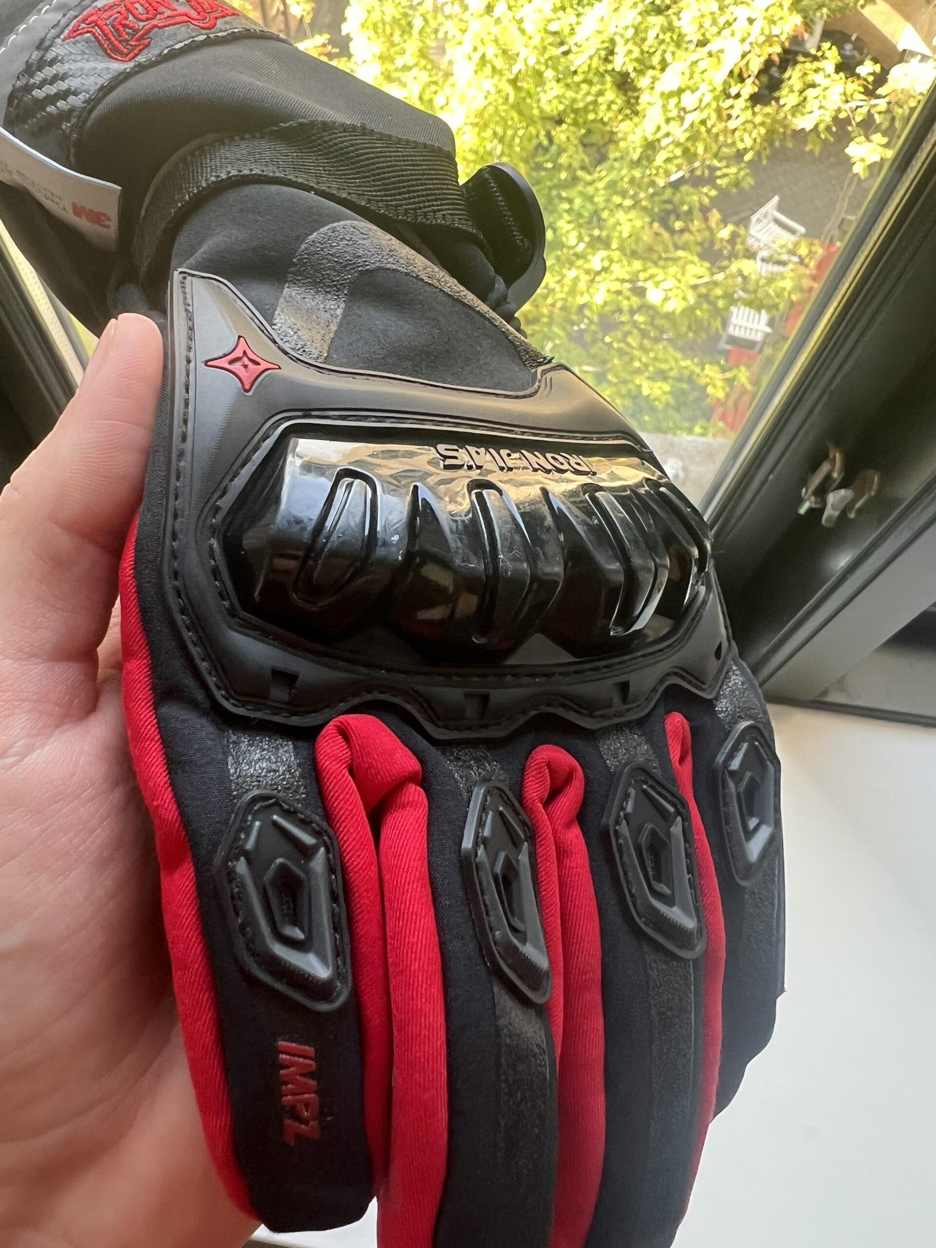 Close-up of IRON JIA'S winter motorcycle glove showing knuckle protection and long-term wear