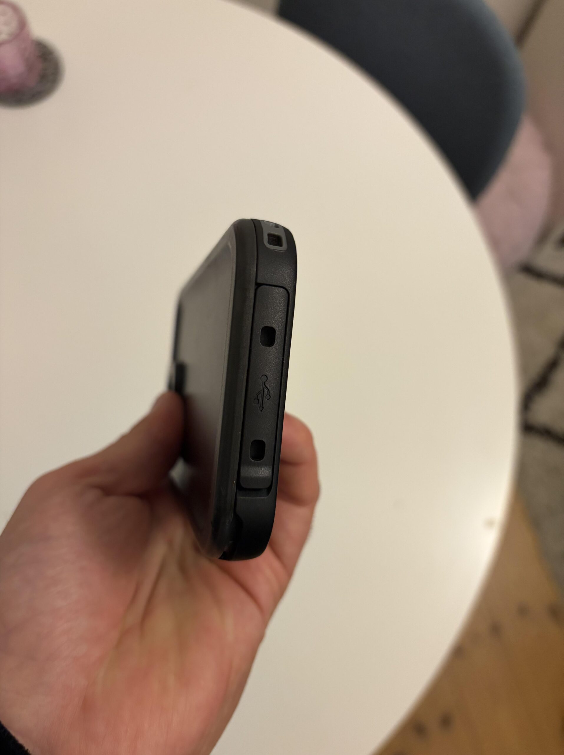 Close-up of the charging port cover on my Cozycase waterproof iPhone 13 Pro case