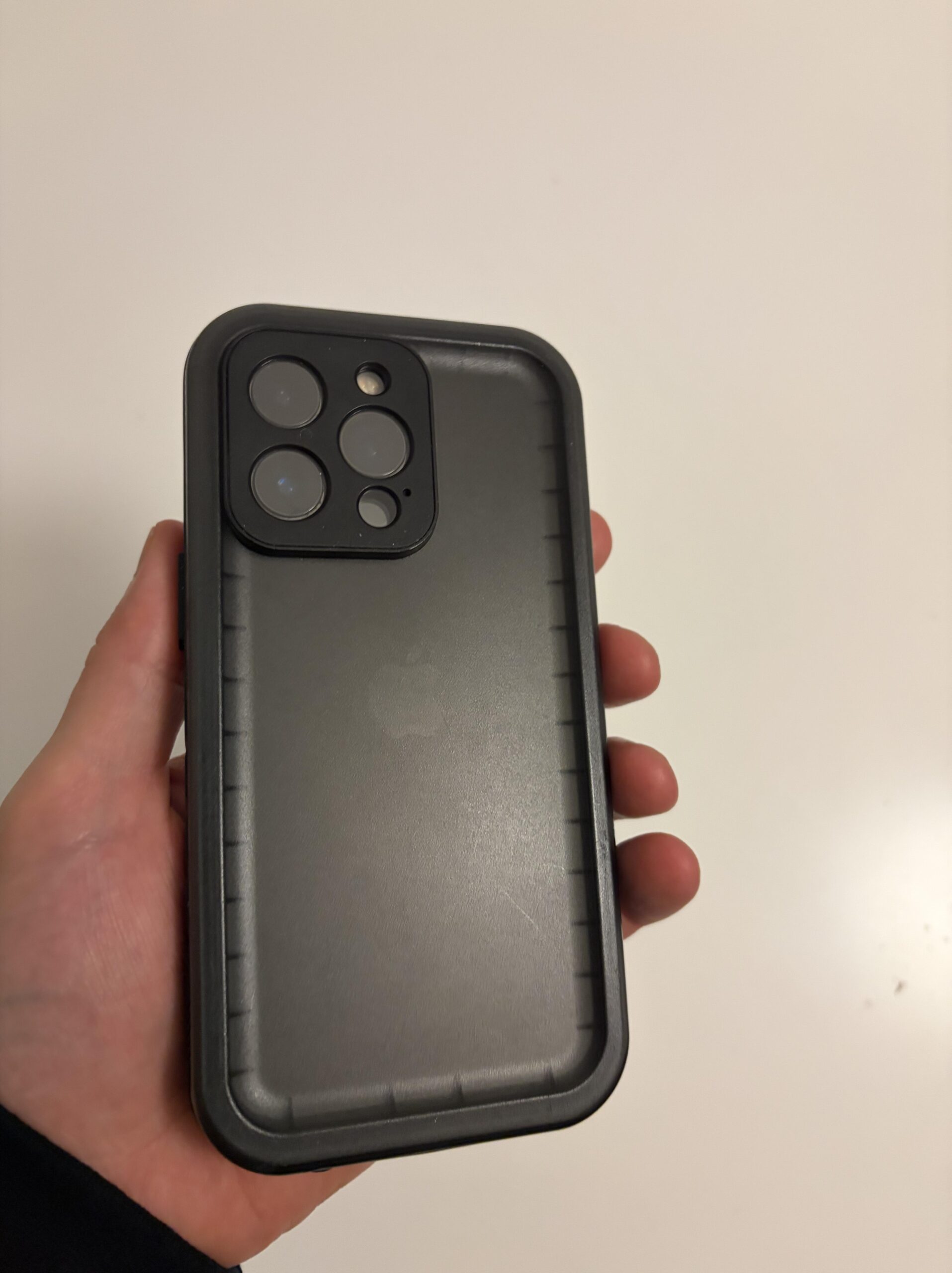 Back view of my black Cozycase waterproof 360 case on an iPhone 13 Pro