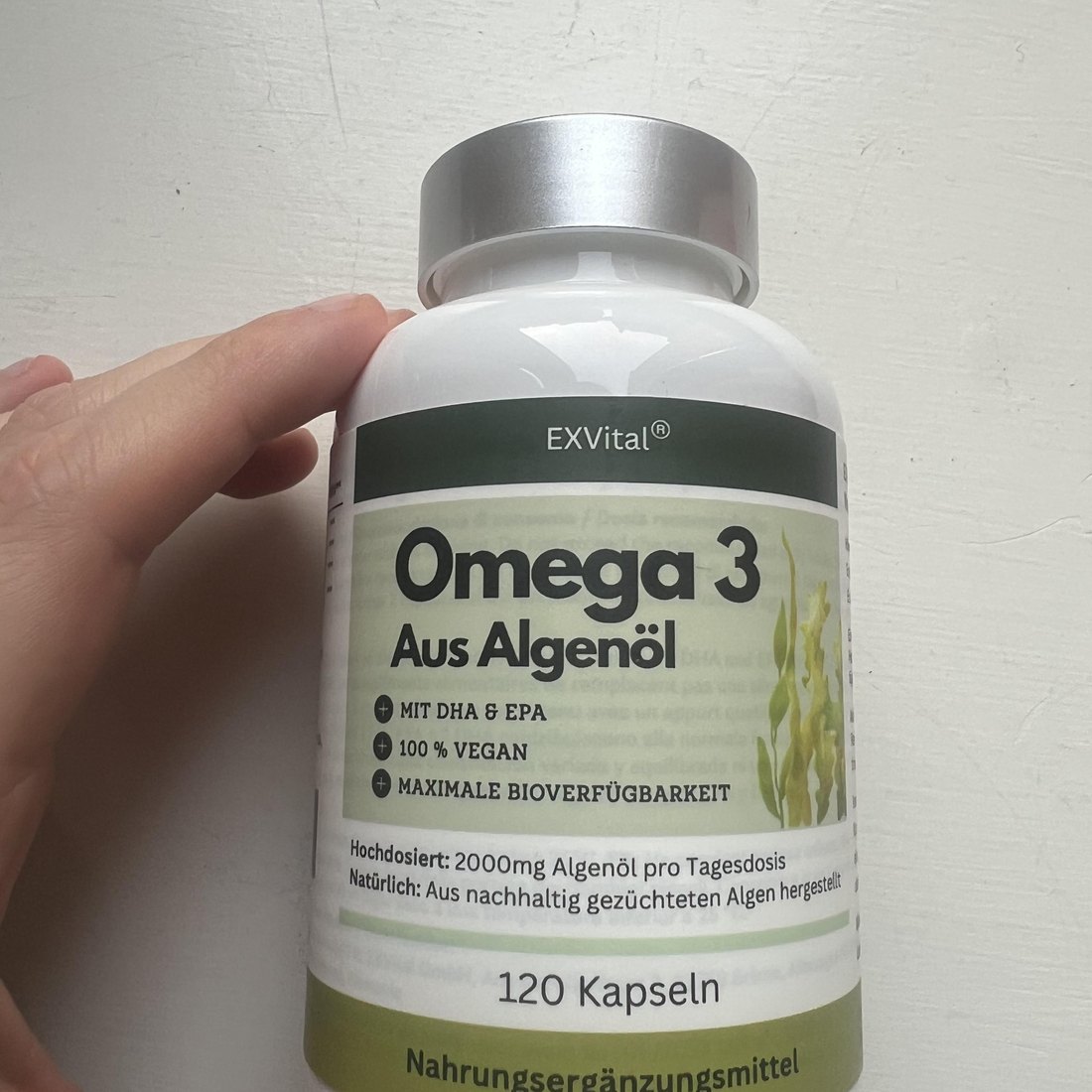 Original photo of EXVital vegan Omega 3 aus Algenöl 120-capsule bottle, front label upright with EXVital brand and 2000 mg algae oil per daily serving