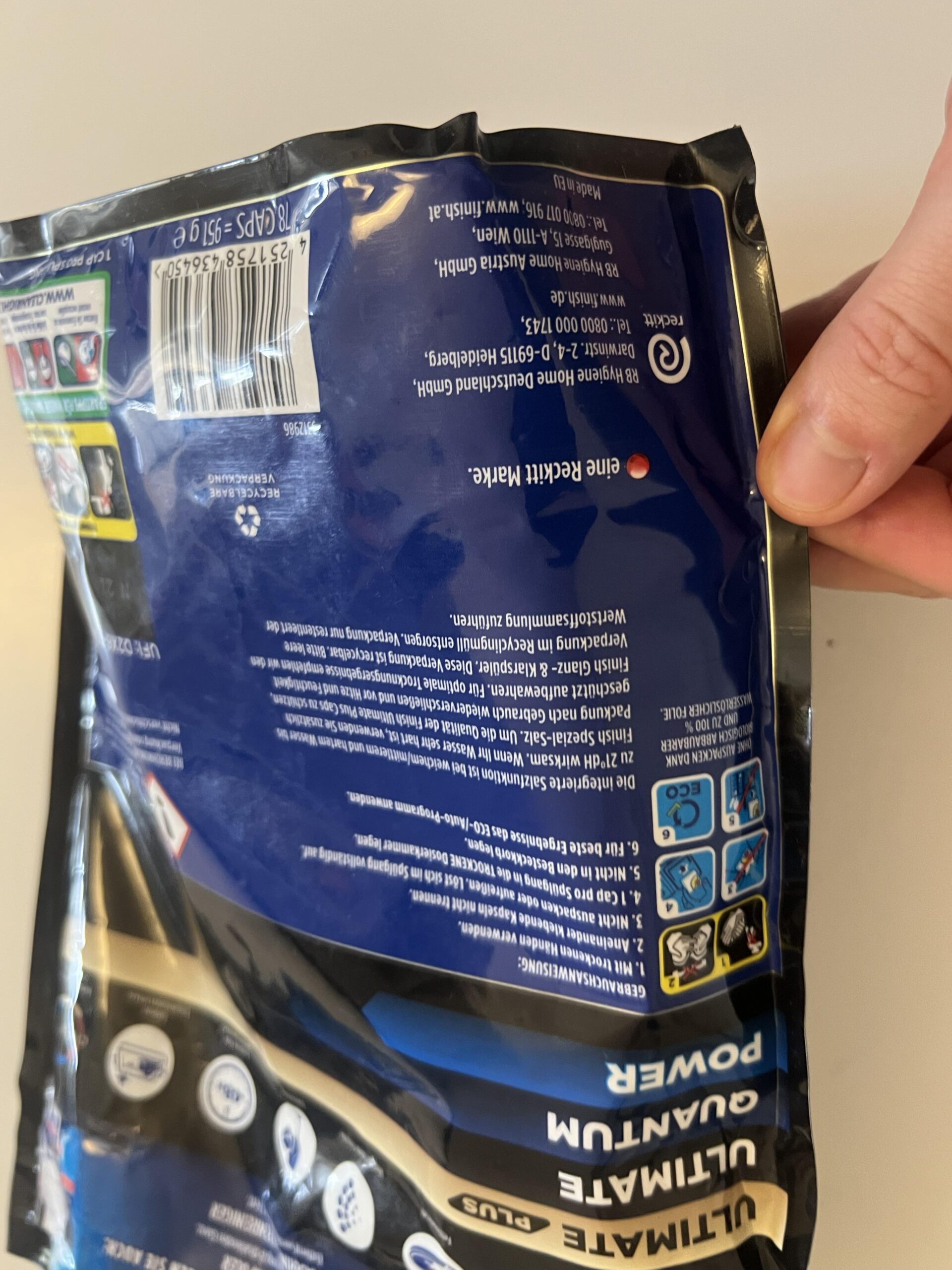 Close-up of the Finish Ultimate Plus Citrus dishwasher capsules pouch label and product barcode