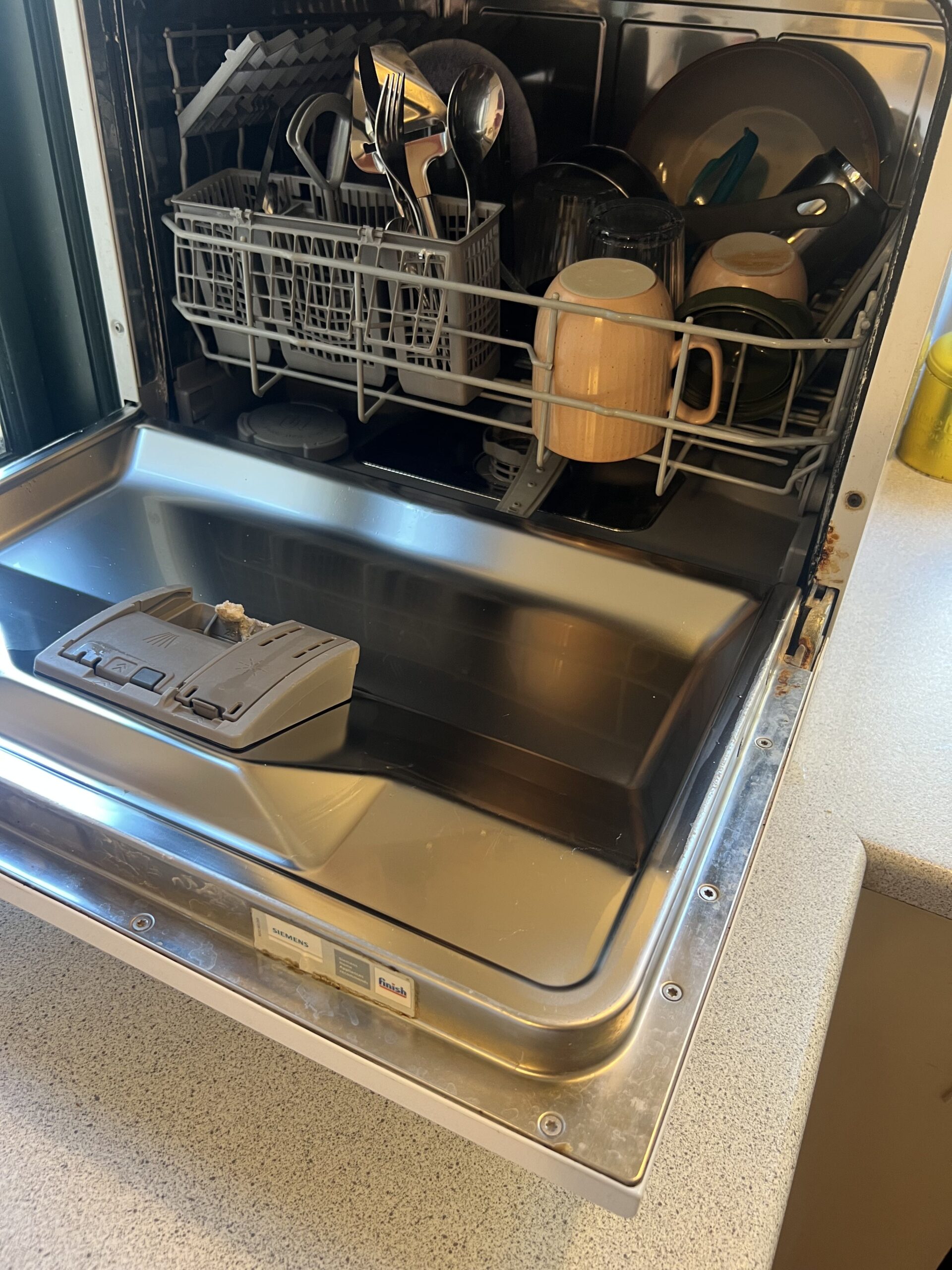 Siemens countertop dishwasher fully loaded with dishes in a two-person household