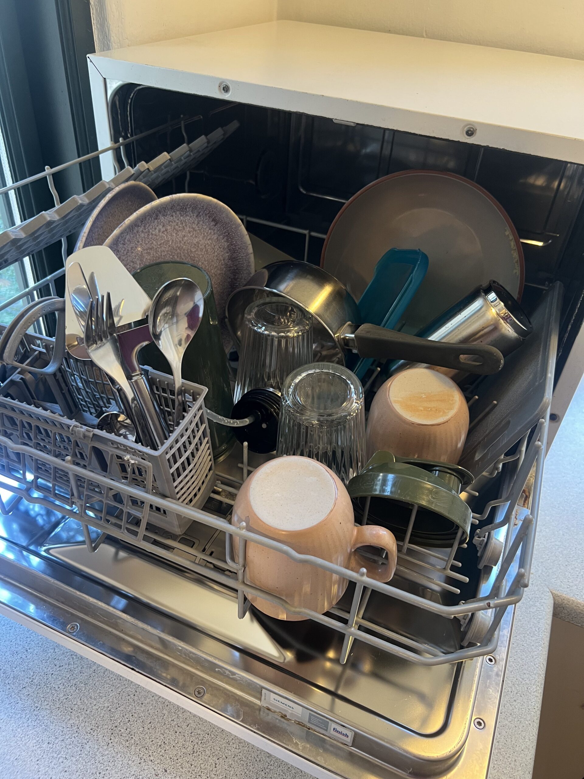 Siemens countertop dishwasher fully loaded before a wash cycle