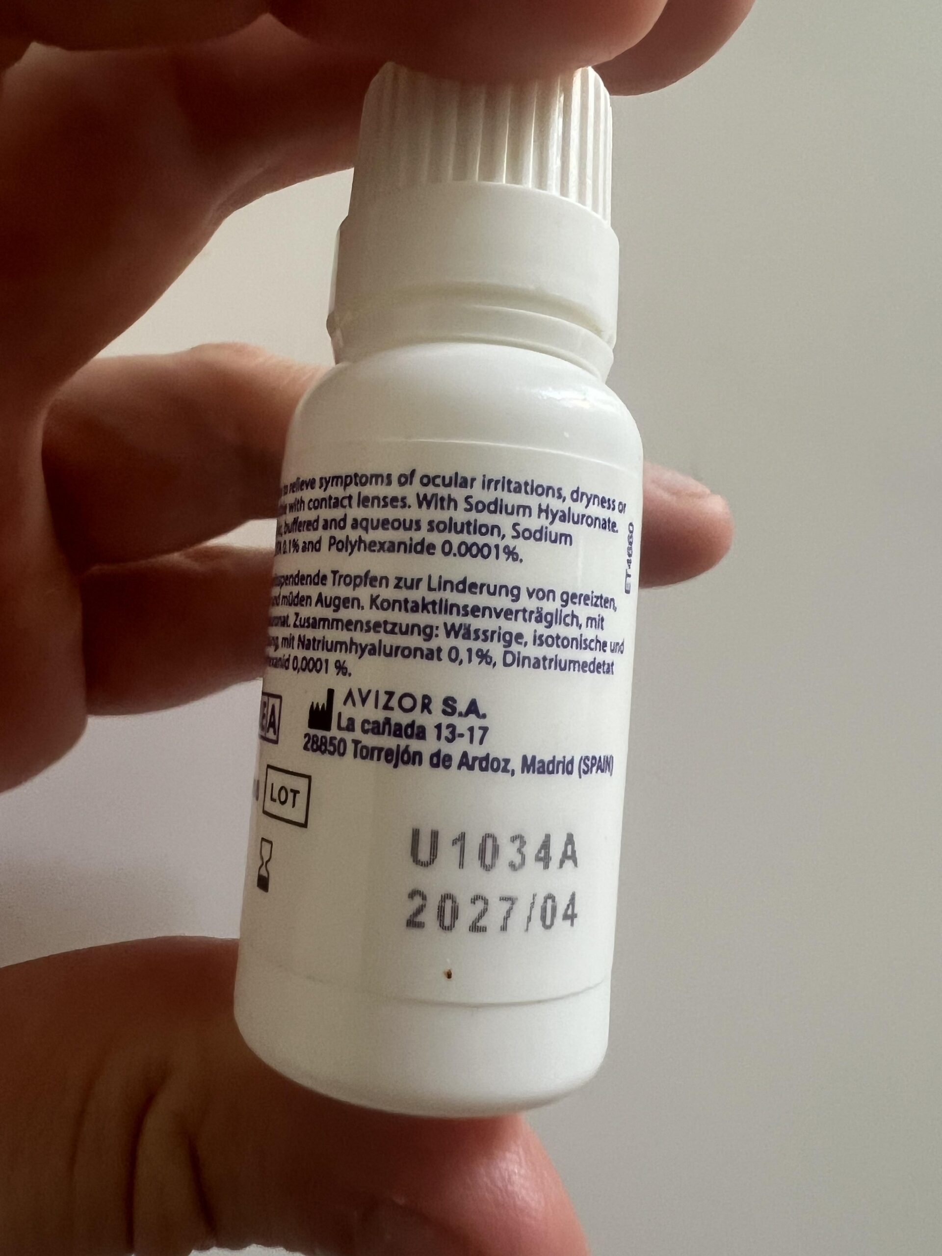 My original photograph of the back of the Glamlens eye drops bottle showing ingredient label and printed expiry date 2027 slash 04