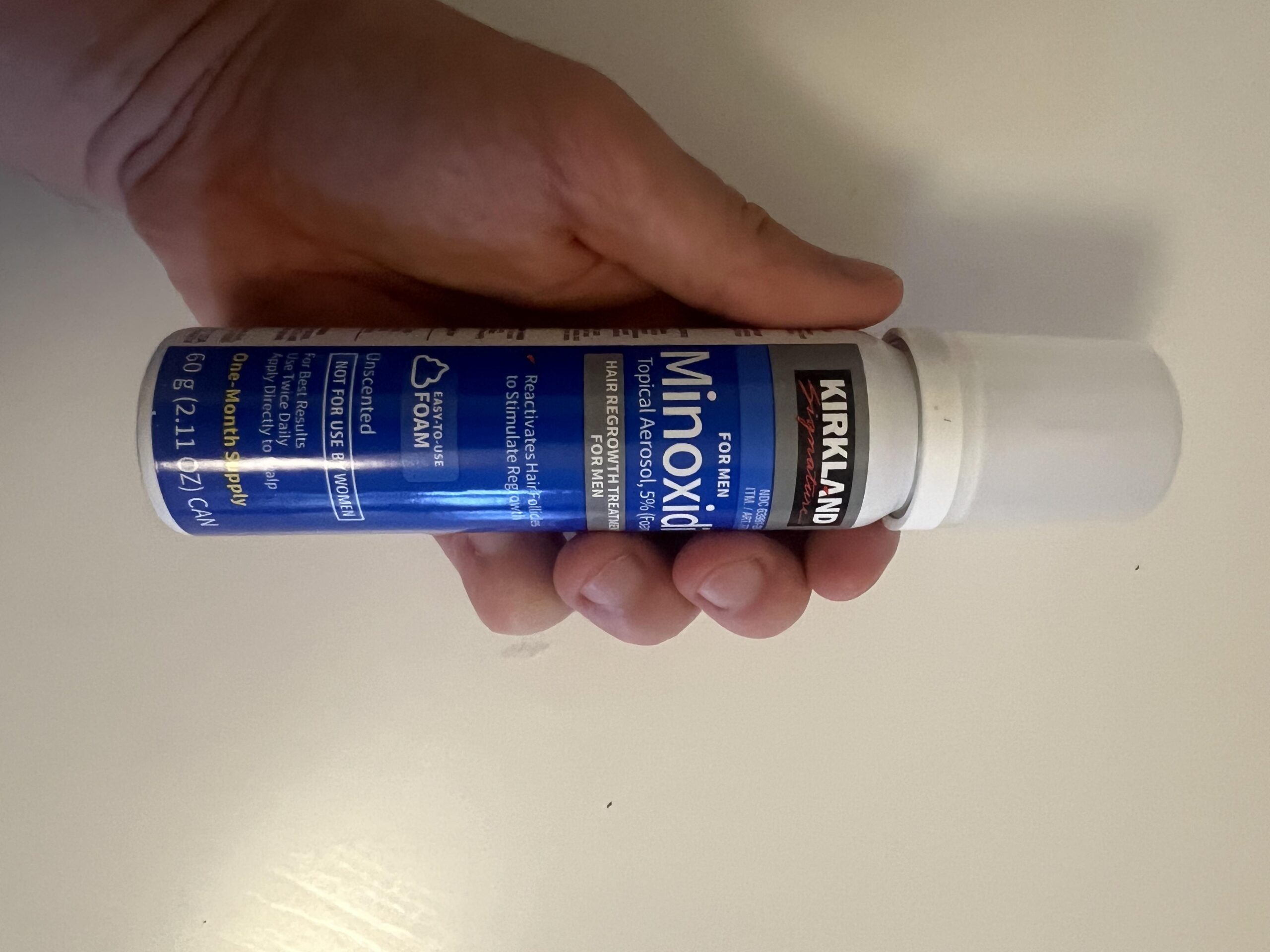 Front label of a Kirkland Signature minoxidil five percent foam for men sixty gram aerosol can