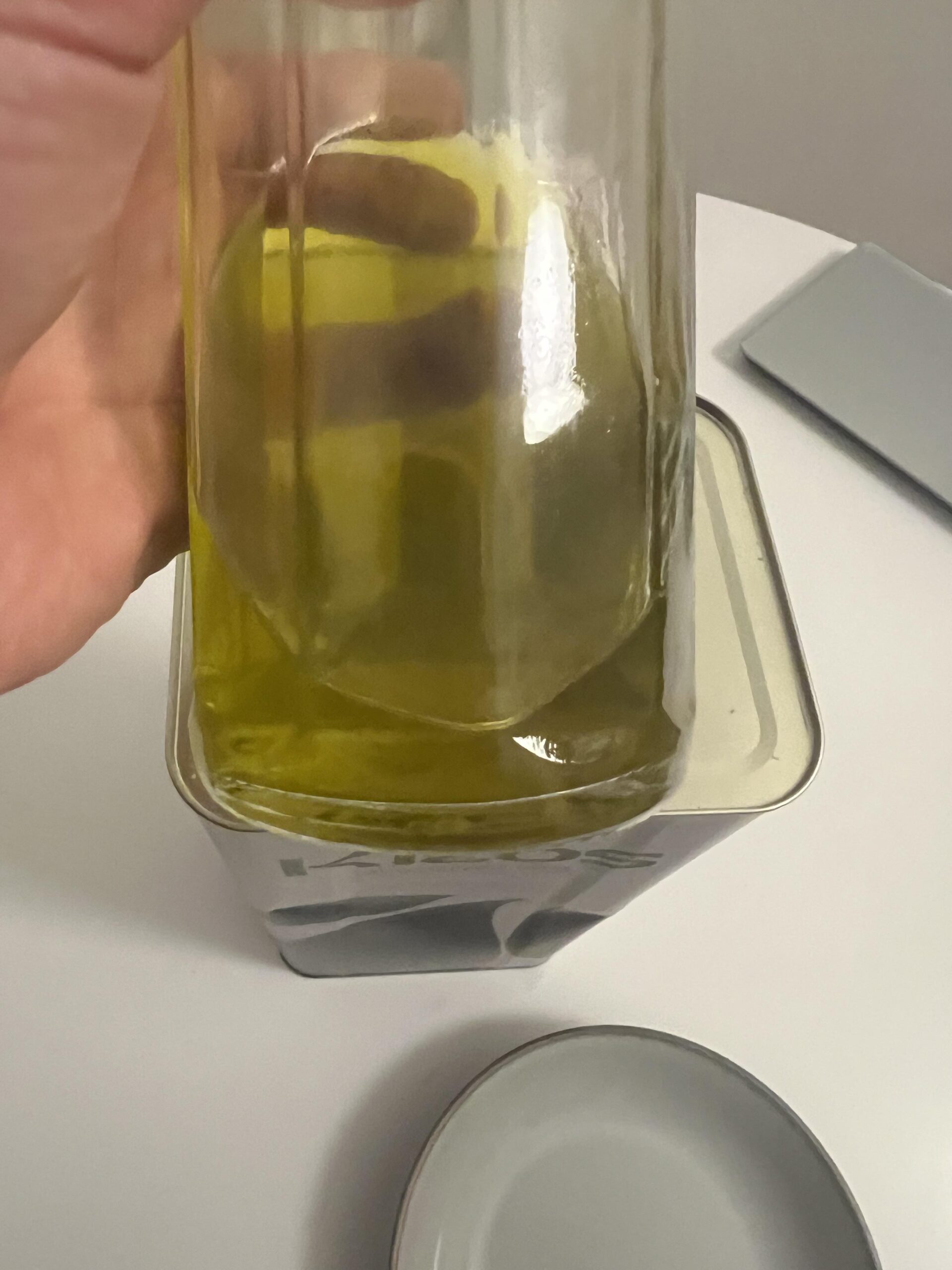Kleos olive oil transferred into a smaller glass bottle