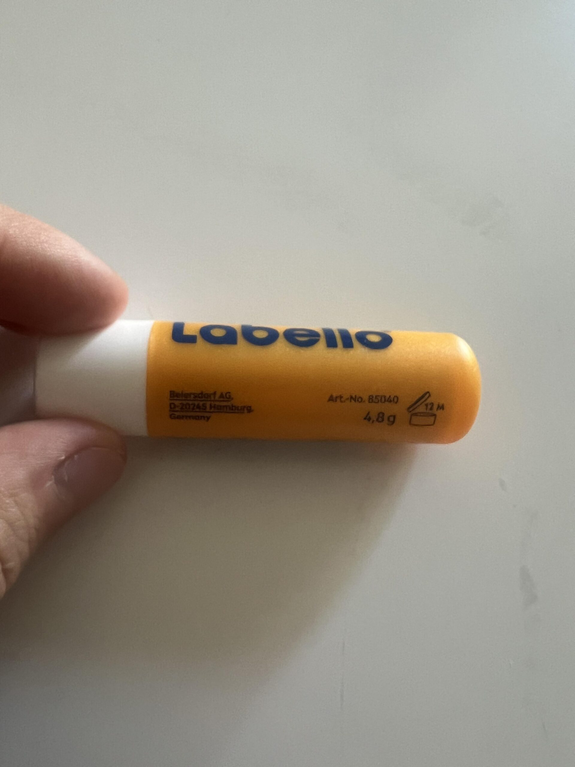 Labello Sun Protect side label with article family 85040, 4.8 g and twelve-month after-opening icon