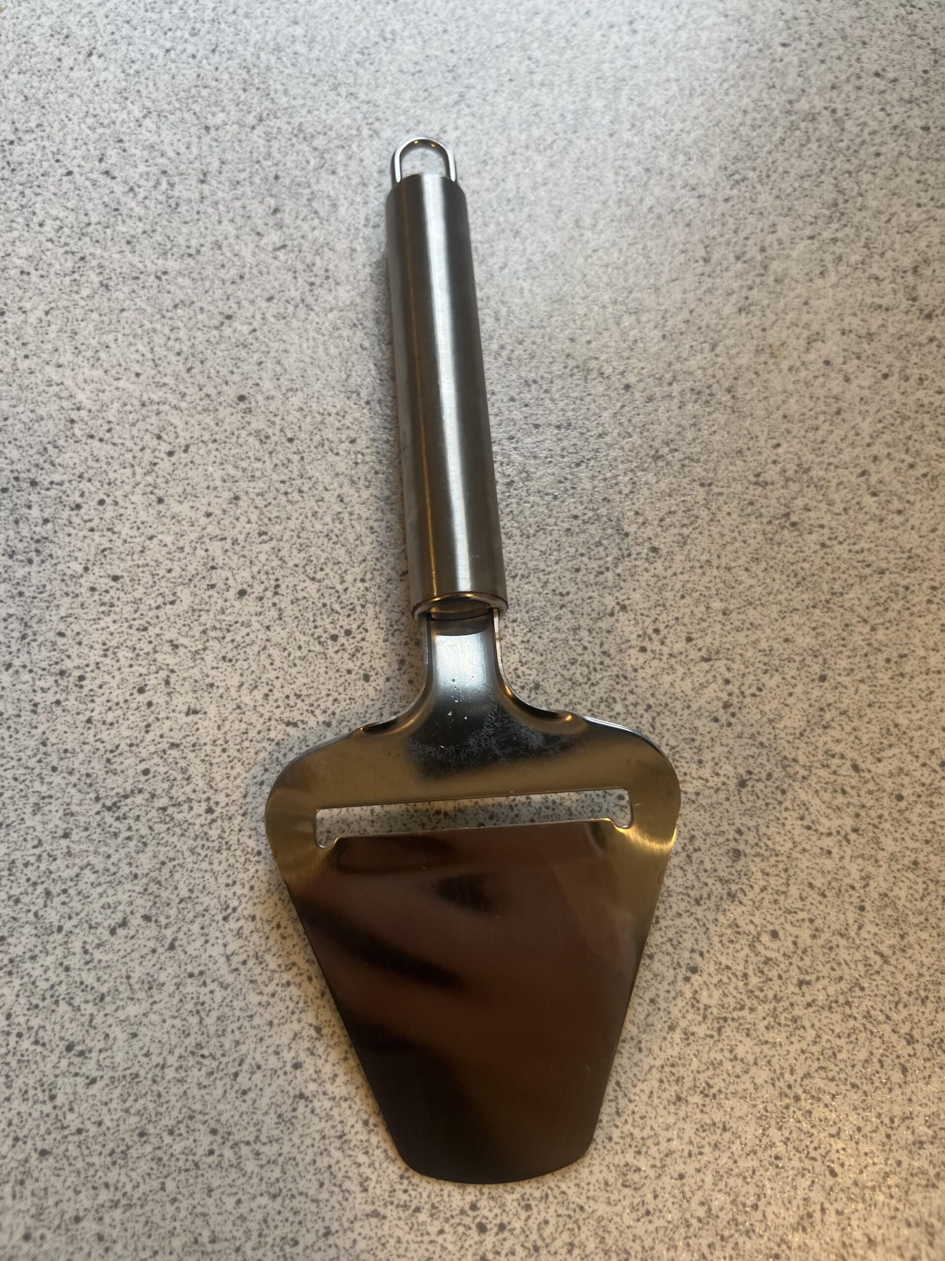 My LAMXD cheese slicer shown at an angle on my kitchen countertop
