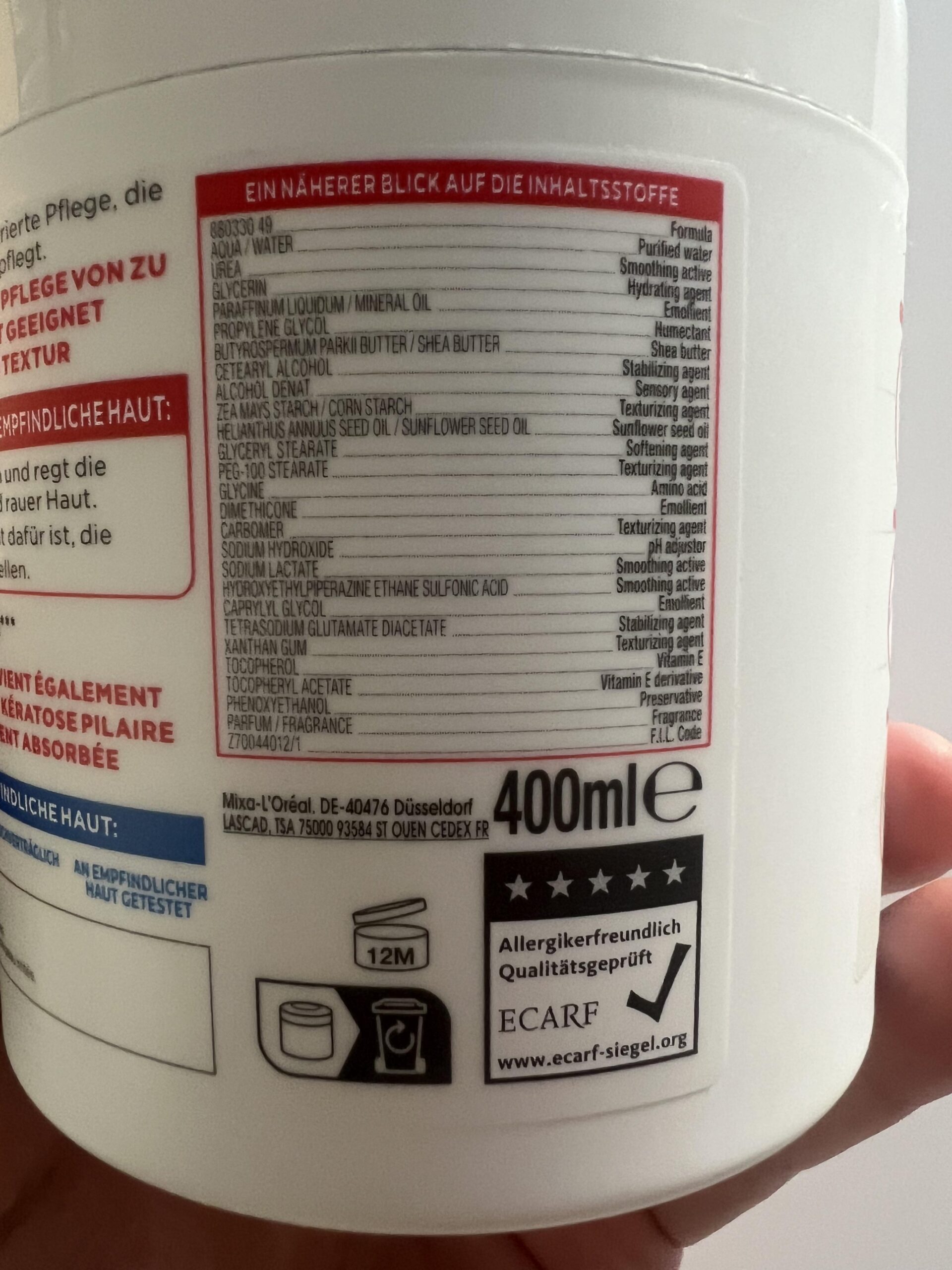 Original Mixa 400 ml jar ingredient list showing urea and fragrance