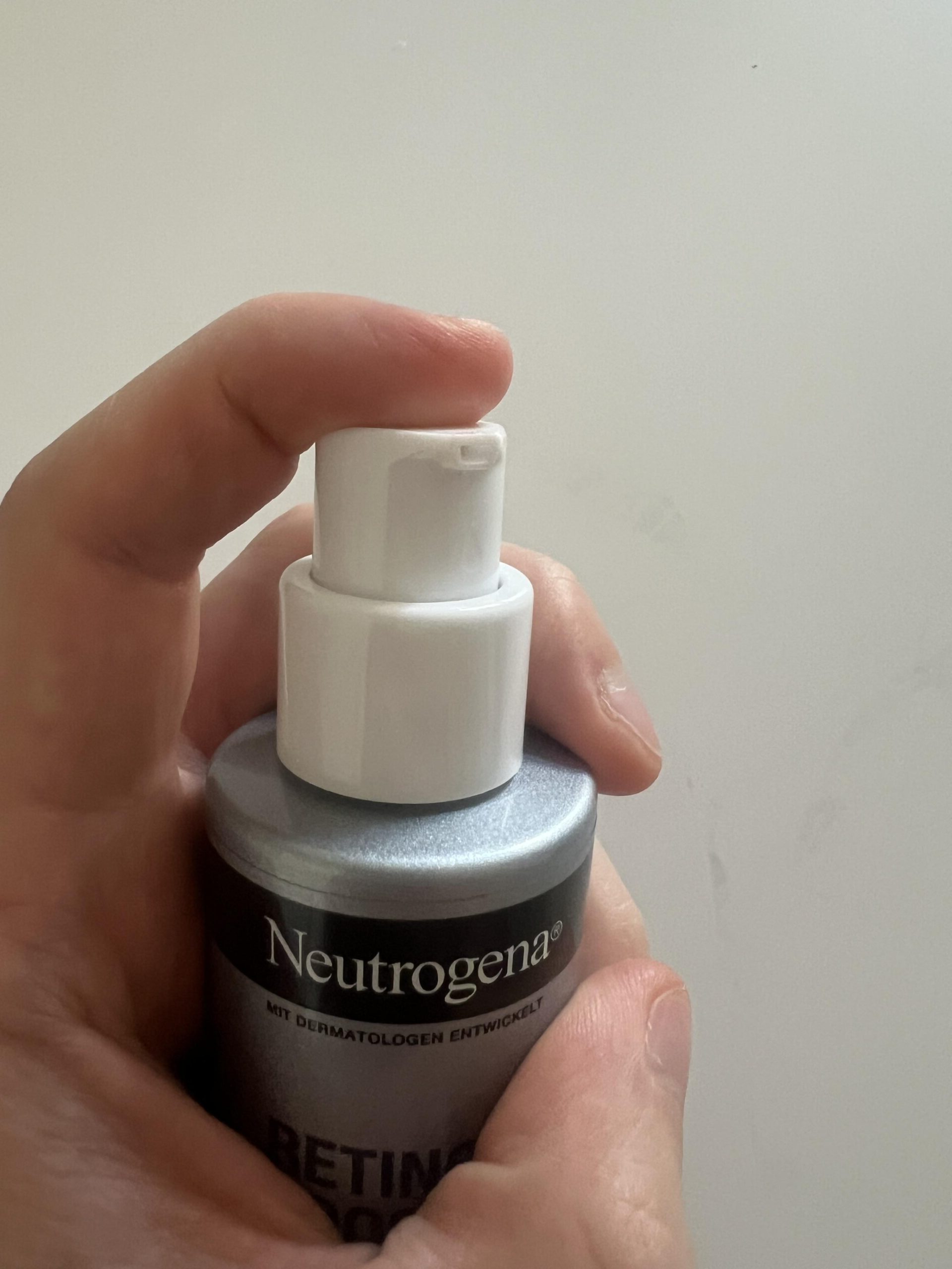 Close-up original photograph of the white dispenser on my Neutrogena Retinol Boost Night Cream 50 ml bottle
