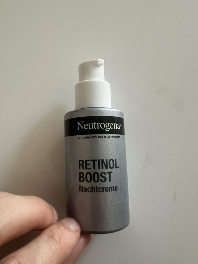 My actual Neutrogena Retinol Boost Nachtcreme 50ml night cream bottle photographed from the front, with grey body and white pump