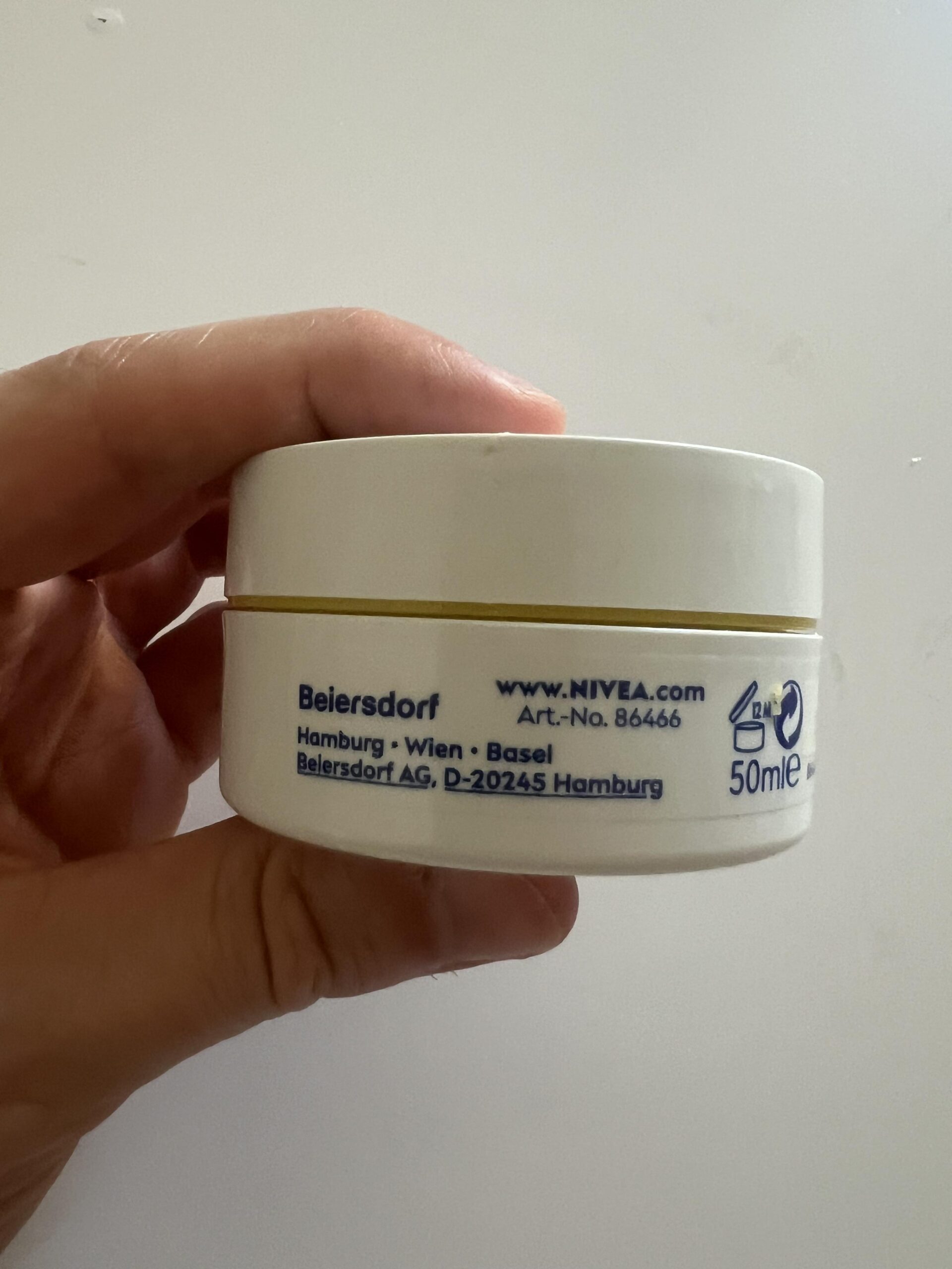 Close-up of the side of the NIVEA Q10 Power day cream jar showing volume and manufacturer information