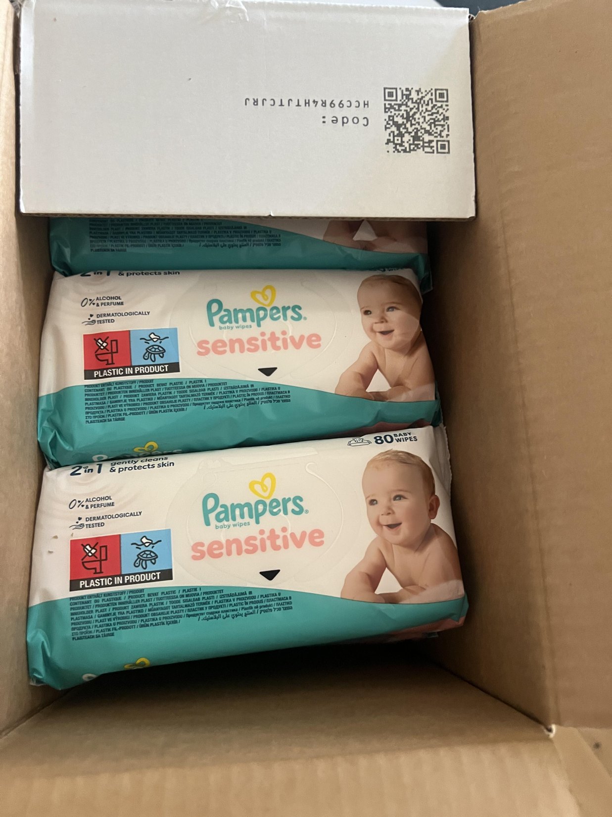 My original opened cardboard delivery carton revealing individually wrapped Pampers Sensitive 80-wipe packs