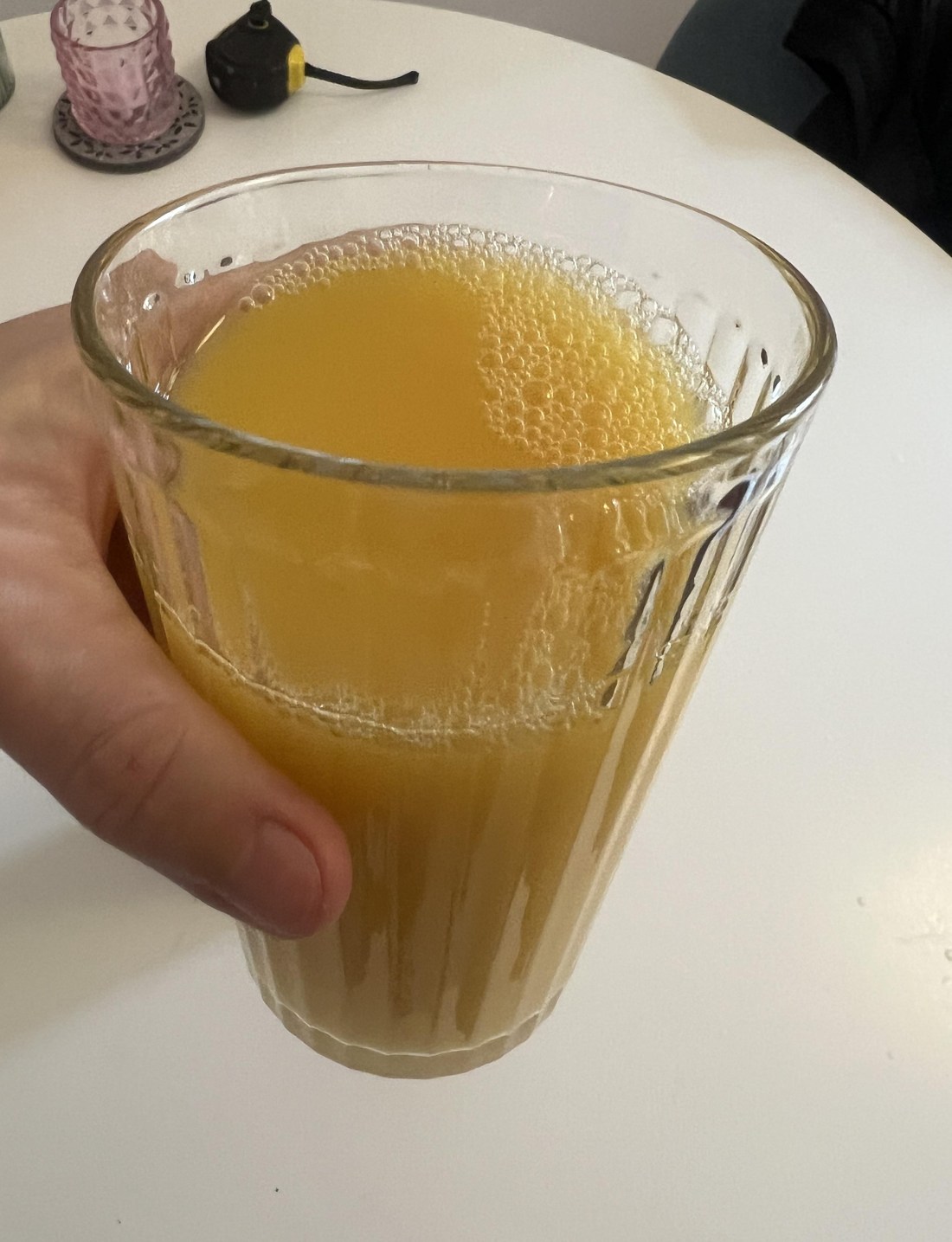 My own glass of golden orange Rauch Happy Day Orange Mild with small bubbles on the surface