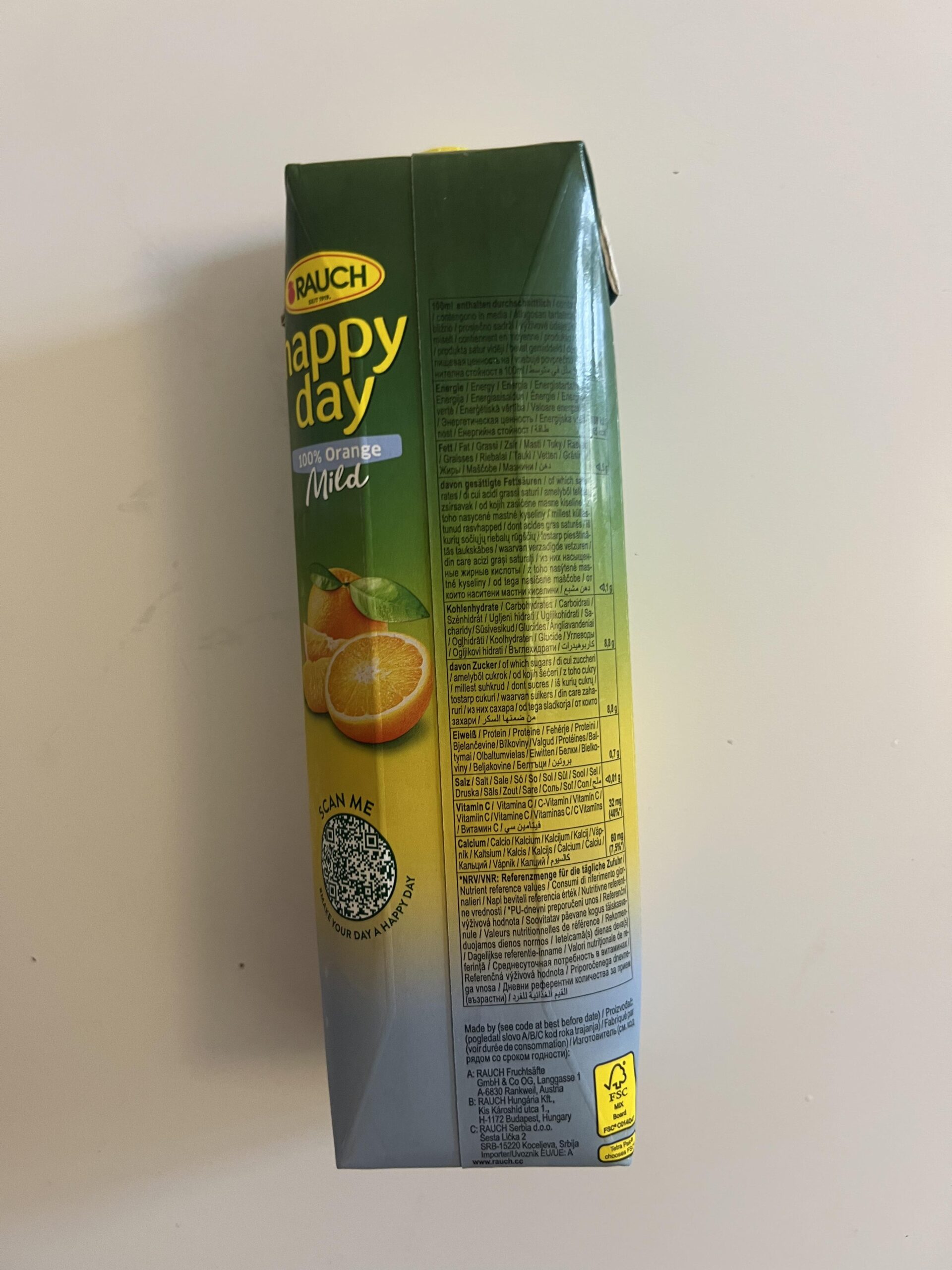 Original Happy Day Orange Mild carton side with multilingual nutrition panel and calcium and vitamin C information