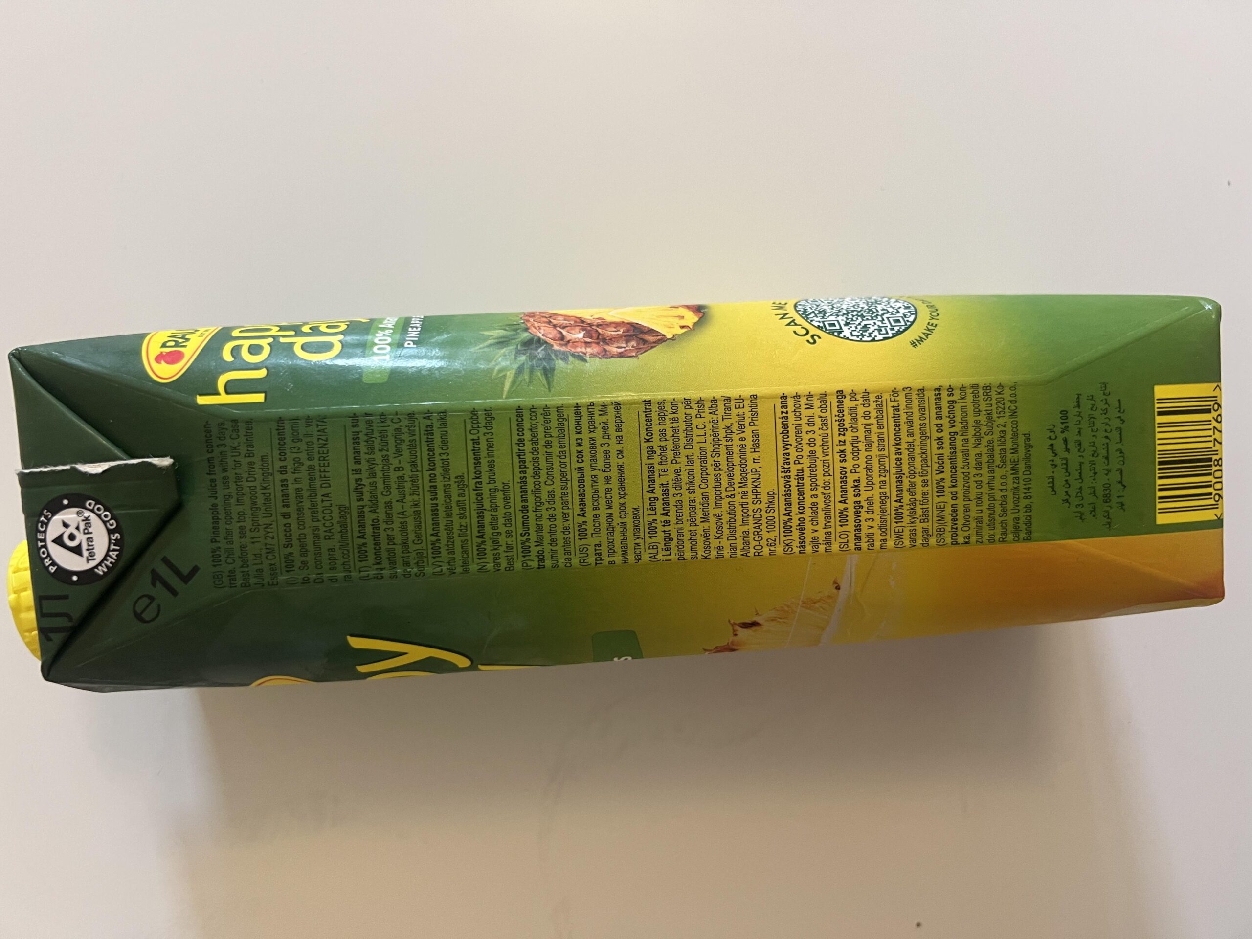 My own photo showing the Rauch Happy Day pineapple juice carton information panel, including nutritional and packaging details