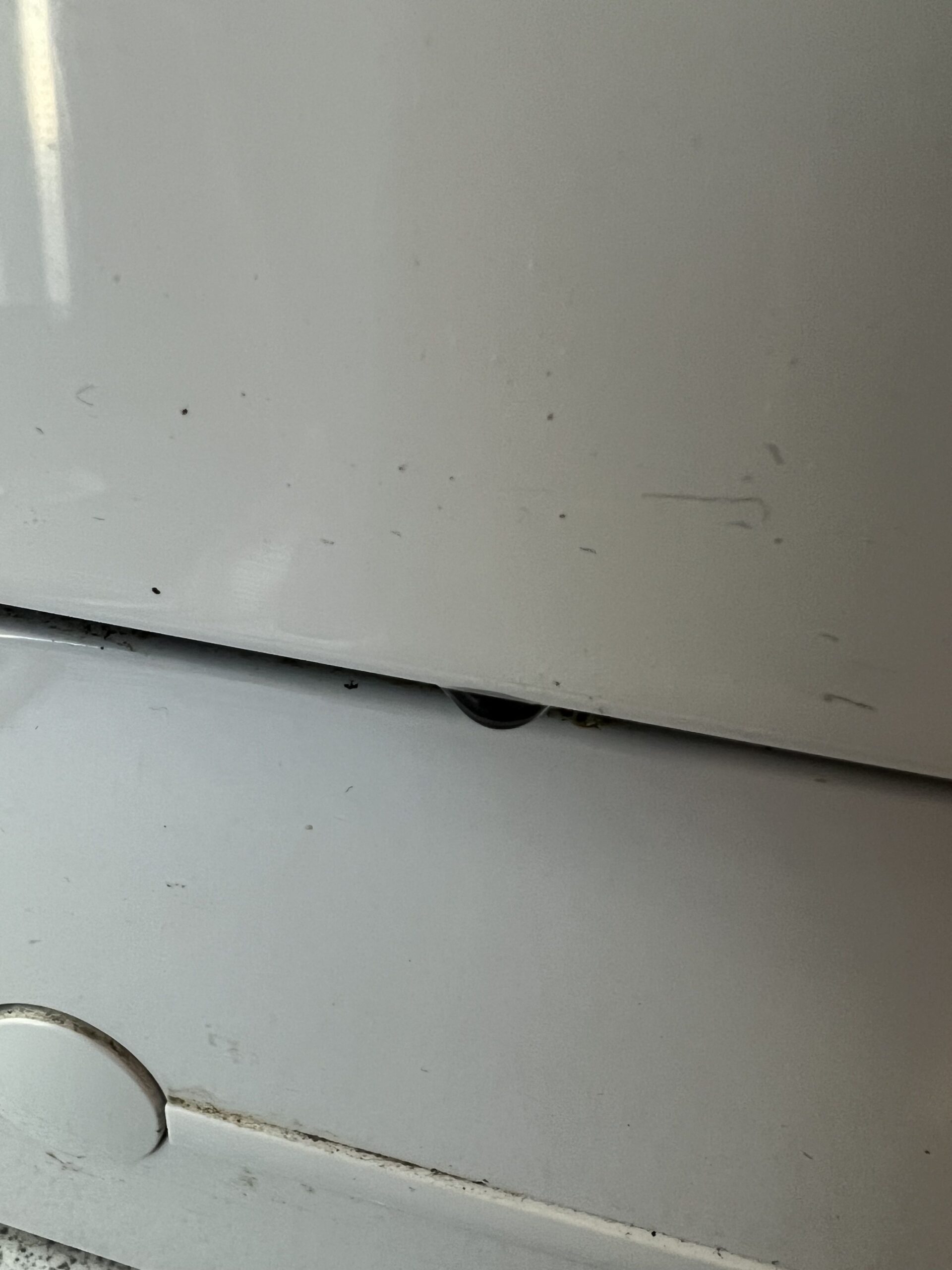 Wear and tear on the front of the Siemens countertop dishwasher after about 14 years