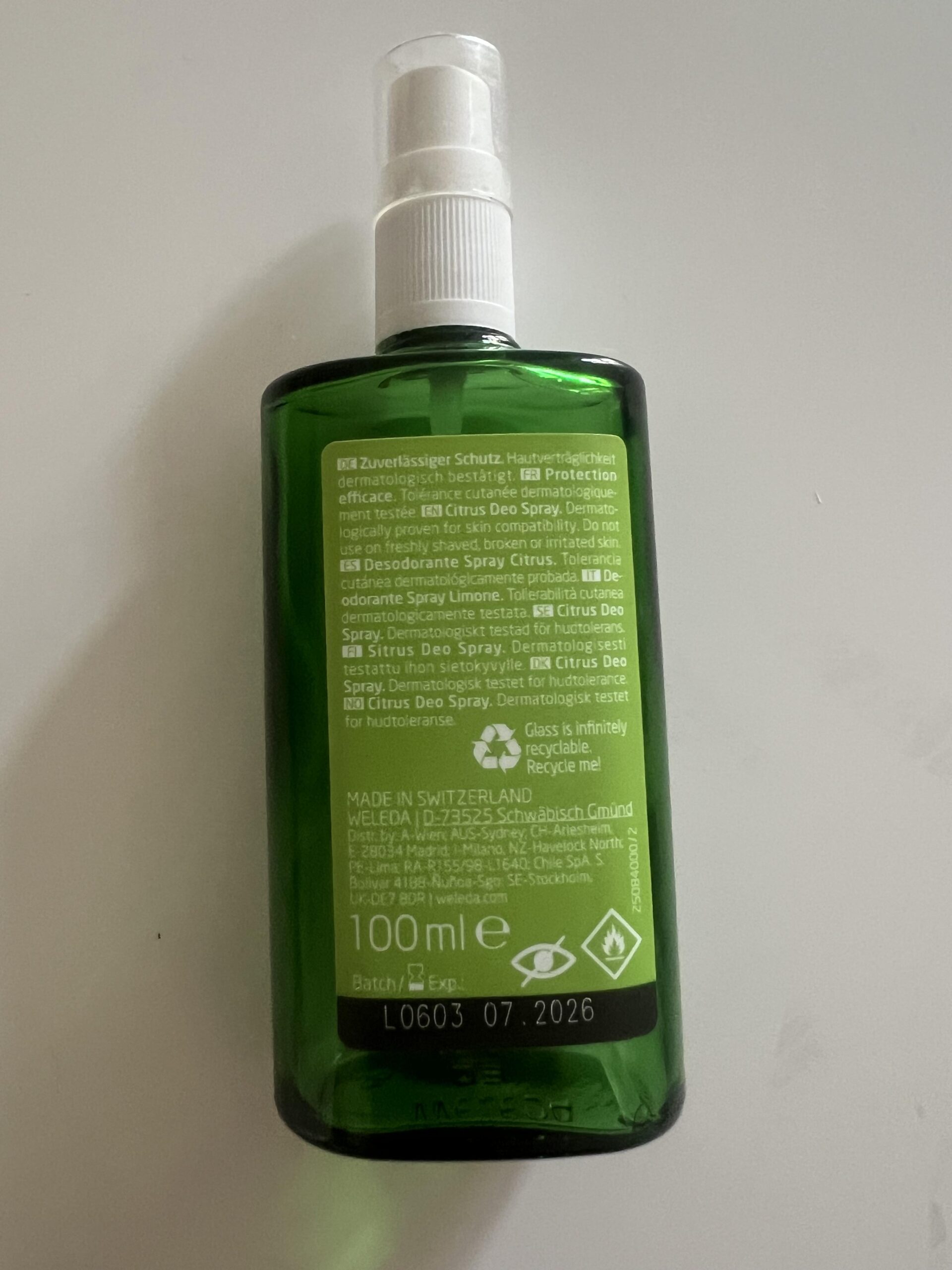 Original back-label photo of my Weleda Citrus Fresh Deo Spray 100 ml bottle with ingredients and flammable warning symbols