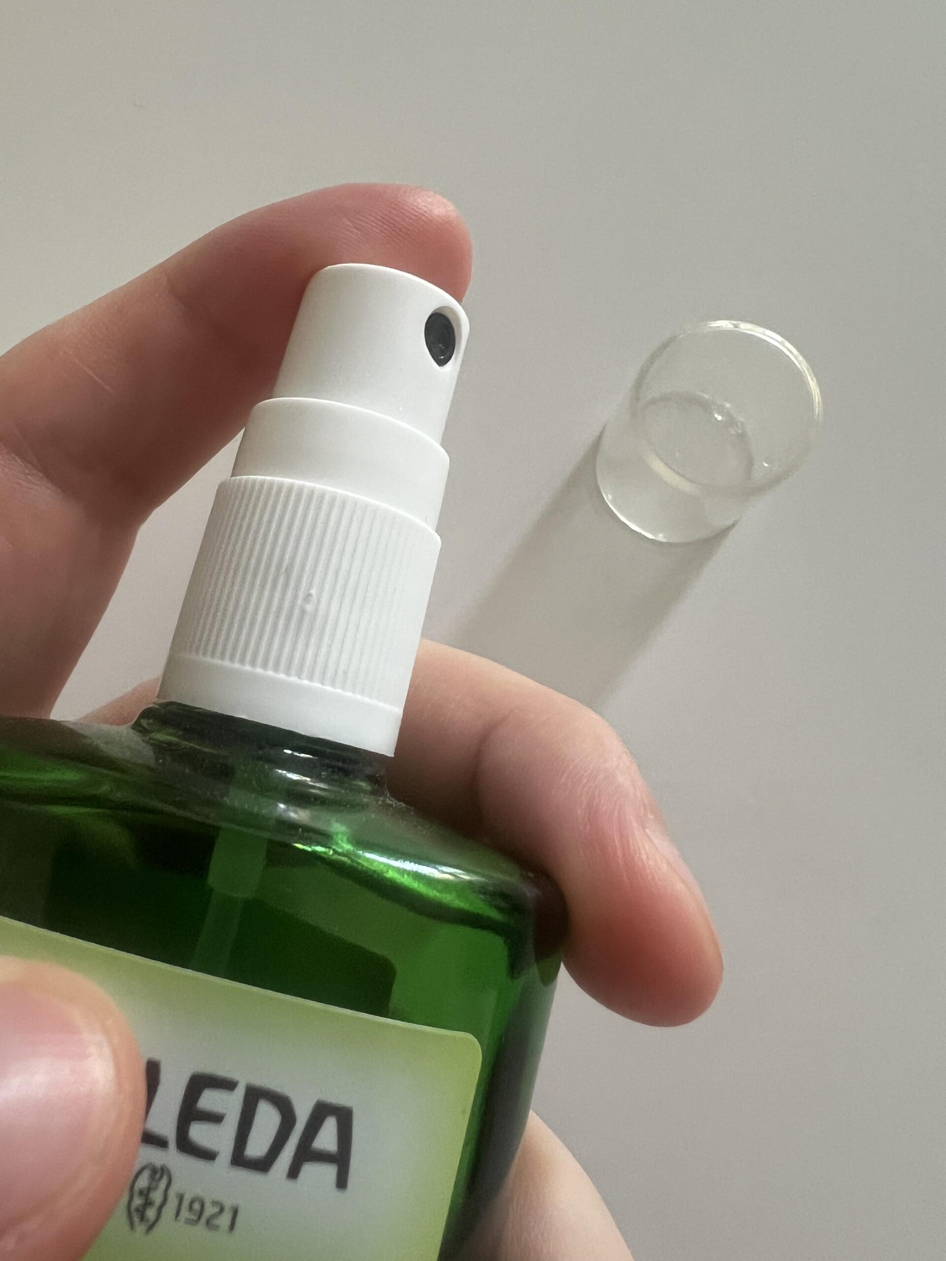 Close-up of the white spray nozzle and transparent cap of my Weleda Citrus Fresh Deo Spray bottle